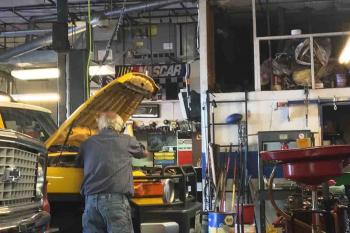 Picture Mechanic replacing a timing Belt